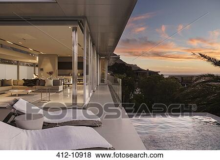 Sunset sky outside modern house View Large Photo Image Stock Photo - Sunset sky outside modern house. Fotosearch