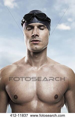 Swimmer wearing cap and goggles View Large Photo Image Stock Photo - Swimmer wearing cap and goggles. Fotosearch