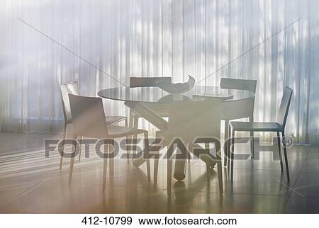 Stock Photo - Table and chairs in dining room. Fotosearch