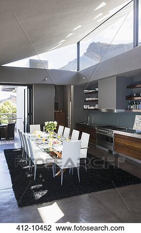 Stock Image - Table and chairs in modern dining room. Fotosearch