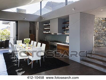 Stock Photo - Table and chairs in modern dining room. Fotosearch