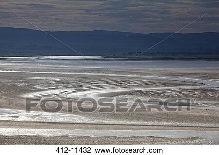 Stock Image - Tide pools on beach at low tide. Fotosearch