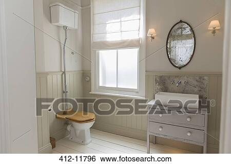 Toilet and sink in ornate bathroom View Large Photo Image Stock Photograph - Toilet and sink in ornate bathroom. Fotosearch