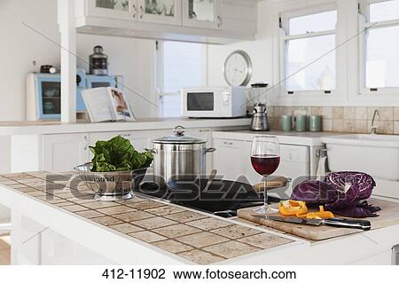 Vegetables and glass of red wine in kitchen View Large Photo Image Stock Image - Vegetables and glass of red wine in kitchen. Fotosearch