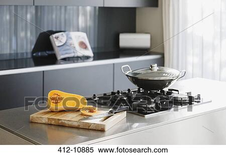 Stock Photography - Vegetables by wok in modern kitchen. Fotosearch