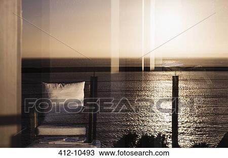View of sunset reflecting on ocean View Large Photo Image Stock Image - View of sunset reflecting on ocean. Fotosearch