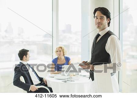 Waiter smiling in restaurant View Large Photo Image Stock Photography - Waiter smiling in restaurant. Fotosearch