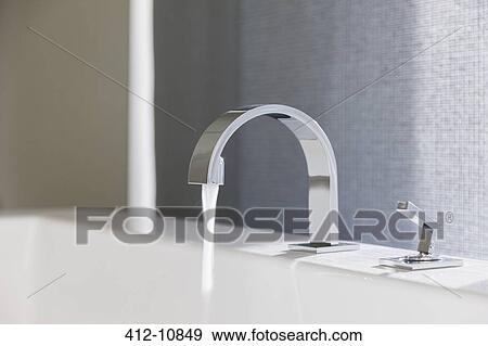 Water emitting from modern faucet View Large Photo Image Stock Photo - Water emitting from modern faucet. Fotosearch
