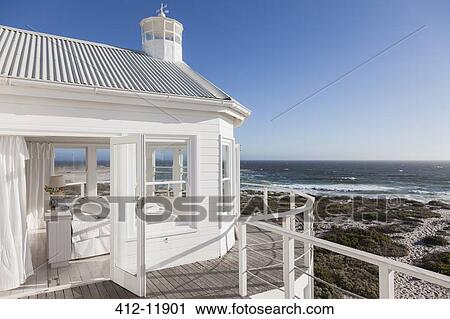 White bedroom overlooking ocean View Large Photo Image Stock Image - White bedroom overlooking ocean. Fotosearch