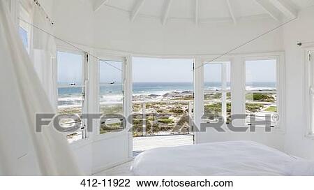 White bedroom overlooking ocean View Large Photo Image Stock Image - White bedroom overlooking ocean. Fotosearch