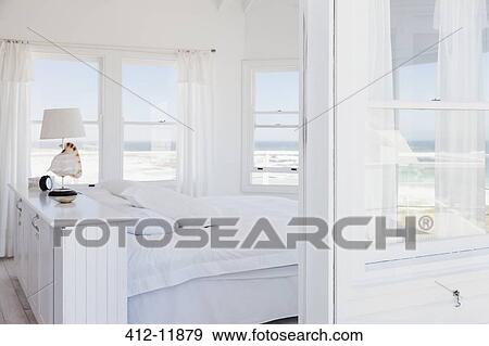 White bedroom overlooking ocean View Large Photo Image Stock Photo - White bedroom overlooking ocean. Fotosearch