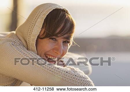 Woman laughing outdoors View Large Photo Image Stock Photo - Woman laughing outdoors. Fotosearch