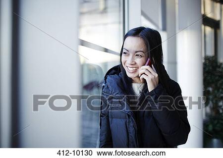 Woman talking on cell phone View Large Photo Image Stock Image - Woman talking on cell phone. Fotosearch
