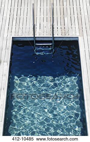 Wooden deck and modern lap pool View Large Photo Image Stock Photography - Wooden deck and modern lap pool. Fotosearch