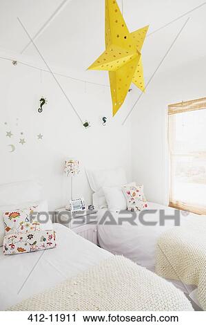 Yellow star lamp and wall decorations in childrens bedroom View Large Photo Image Stock Image - Yellow star lamp and wall decorations in childrens bedroom. Fotosearch