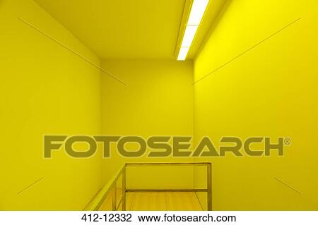 Stock Image - Banister in yellow room. Fotosearch