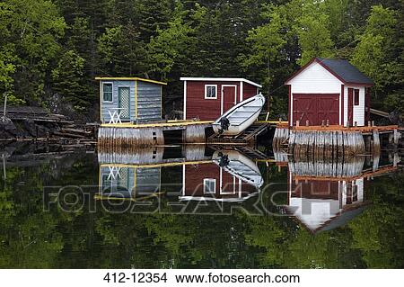 Boat and buildings on calm bay View Large Photo Image Picture - Boat and buildings on calm bay. Fotosearch