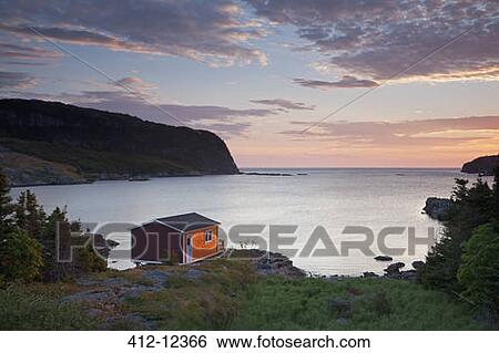 Boathouse overlooking calm bay at sunrise View Large Photo Image Stock Photograph - Boathouse overlooking calm bay at sunrise. Fotosearch