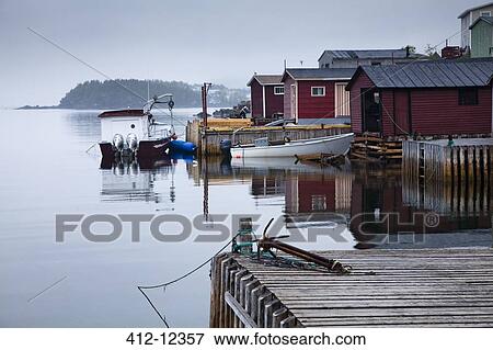 Boats and buildings on calm bay View Large Photo Image Stock Photo - Boats and buildings on calm bay. Fotosearch