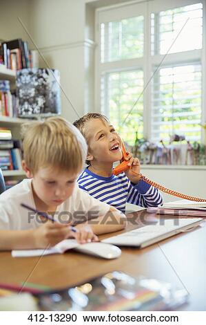 Boys working in home office View Large Photo Image Stock Image - Boys working in home office. Fotosearch