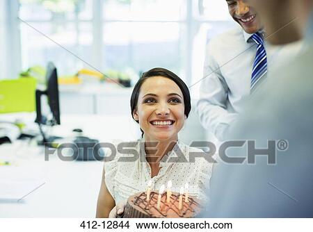 Business people celebrating birthday in office View Large Photo Image Picture - Business people celebrating birthday in office. Fotosearch