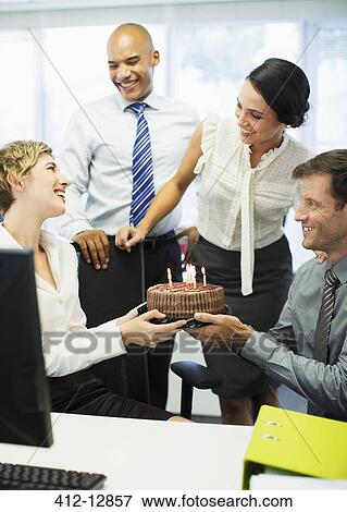 Business people celebrating birthday in office View Large Photo Image Stock Photo - Business people celebrating birthday in office. Fotosearch