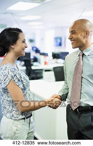 Business people shaking hands in office View Large Photo Image Stock Photography - Business people shaking hands in office. Fotosearch