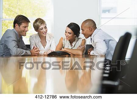 Stock Photograph - Business people sitting in conference call. Fotosearch