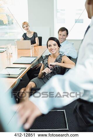 Business people sitting in meeting View Large Photo Image Stock Image - Business people sitting in meeting. Fotosearch