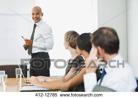 Business people sitting in meeting View Large Photo Image Stock Photography - Business people sitting in meeting. Fotosearch