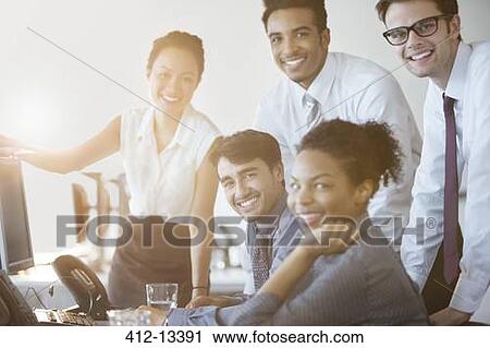 Business people smiling at computer in office View Large Photo Image Stock Image - Business people smiling at computer in office. Fotosearch