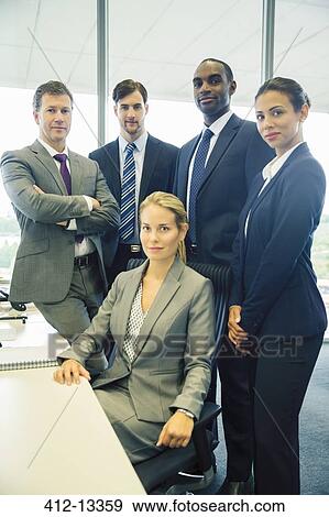 Business people smiling in office View Large Photo Image Stock Photo - Business people smiling in office. Fotosearch