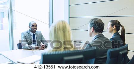 Business people talking in meeting View Large Photo Image Stock Image - Business people talking in meeting. Fotosearch