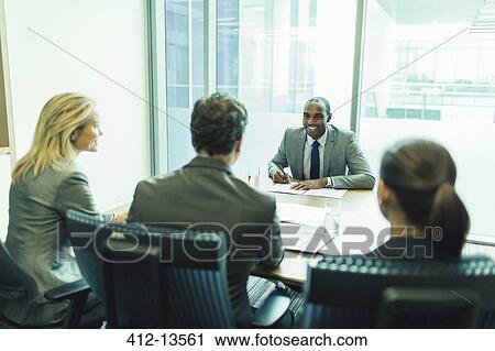 Business people talking in meeting View Large Photo Image Stock Image - Business people talking in meeting. Fotosearch