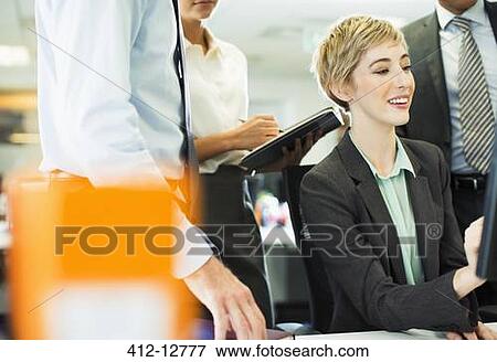 Business people talking in office View Large Photo Image Stock Photo - Business people talking in office. Fotosearch