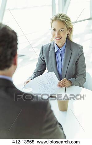 Business people talking in office View Large Photo Image Stock Photo - Business people talking in office. Fotosearch