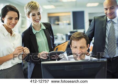 Business people working at computer in office View Large Photo Image Stock Photo - Business people working at computer in office. Fotosearch