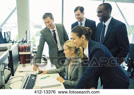 Business people working at computer in office View Large Photo Image Stock Photograph - Business people working at computer in office. Fotosearch