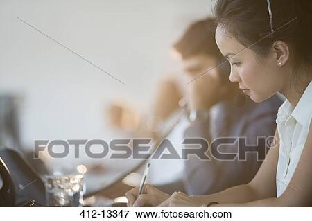Business people working in office View Large Photo Image Stock Photo - Business people working in office. Fotosearch