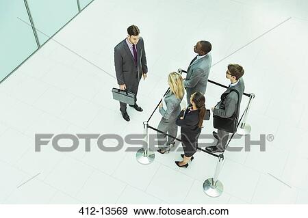 Businessman standing outside roped-off square View Large Photo Image Stock Photo - Businessman standing outside roped-off square. Fotosearch