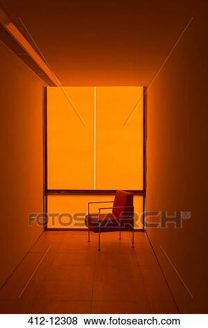 Chair at window in orange office View Large Photo Image Stock Photo - Chair at window in orange office. Fotosearch
