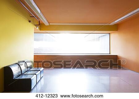 Stock Image - Chairs and window in empty lobby. Fotosearch