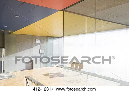 Stock Photo - Chairs and window in sunny office lobby. Fotosearch