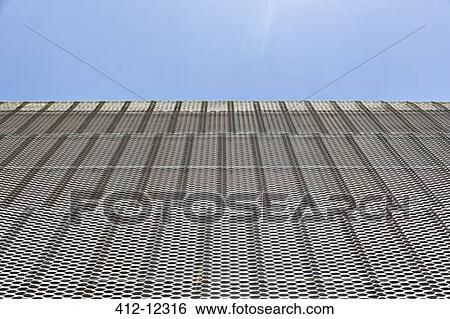 Stock Photograph - Close up of textured wall on modern building. Fotosearch