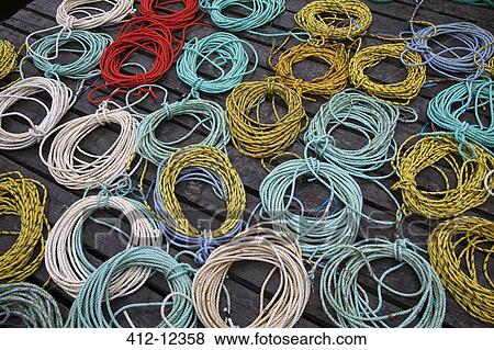 Coils of fishing rope on dock View Large Photo Image Stock Photo - Coils of fishing rope on dock. Fotosearch