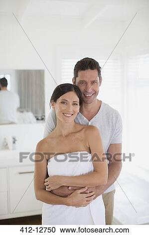 Couple hugging in bathroom View Large Photo Image Stock Image - Couple hugging in bathroom. Fotosearch