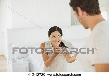 Couple playing together in bedroom View Large Photo Image Stock Image - Couple playing together in bedroom. Fotosearch