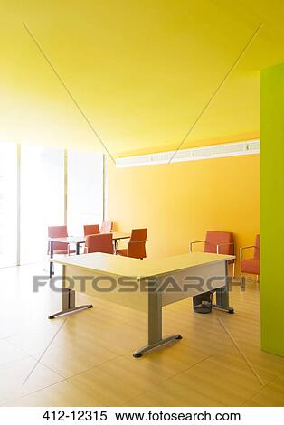 Desks and chairs in bright office View Large Photo Image Stock Photography - Desks and chairs in bright office. Fotosearch