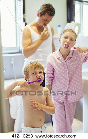 Father and children brushing teeth in bathroom View Large Photo Image Stock Image - Father and children brushing teeth in bathroom. Fotosearch