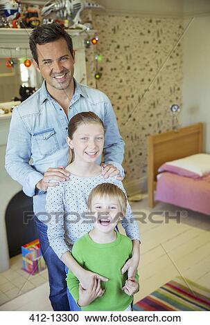 Father and children smiling in bedroom View Large Photo Image Stock Image - Father and children smiling in bedroom. Fotosearch